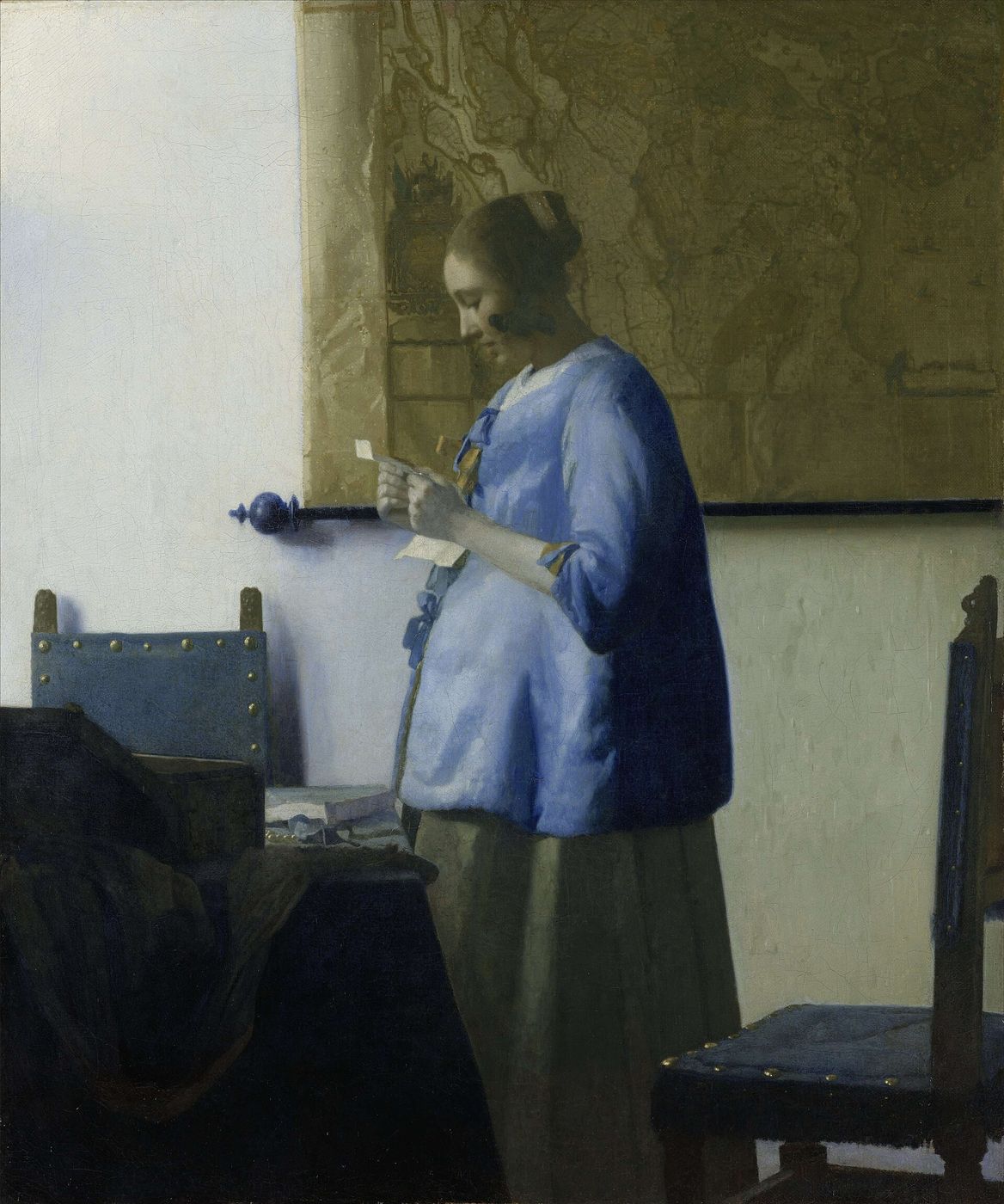 Vermeer — a woman reading a letter in quiet light
